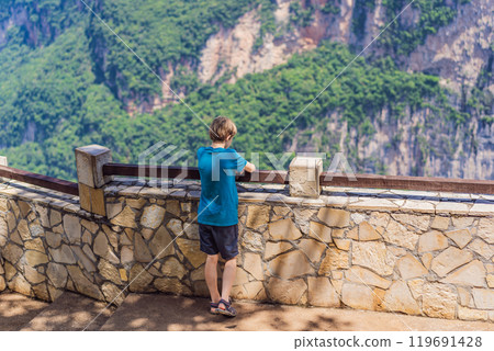 Boy traveler exploring Sumidero Canyon National Park, Mexico. Adventure, natural exploration, and travel experience concept 119691428