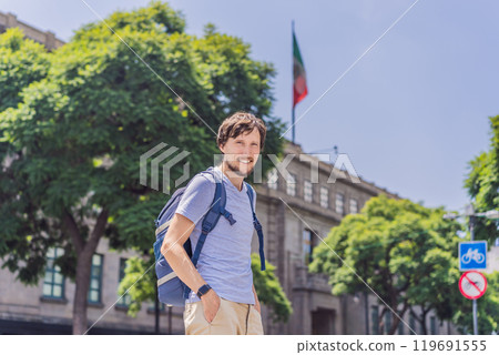 Male tourist in the central square of Mexico City, Zocalo. Cultural exploration, travel, and historic architecture concept 119691555