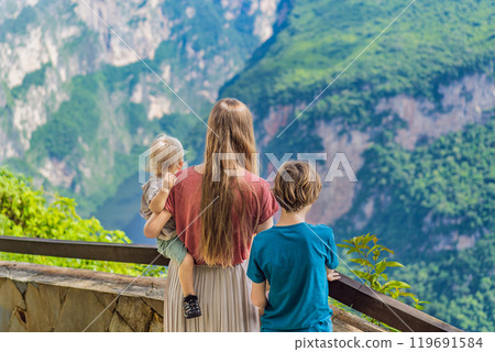 Mom and her two sons baby and teenager travelers exploring Sumidero Canyon National Park, Mexico. Adventure, natural exploration, and travel experience concept 119691584