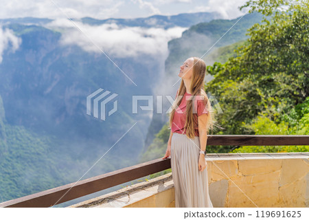 Female tourist exploring Sumidero Canyon National Park, Mexico. Adventure, natural exploration, and travel experience concept 119691625