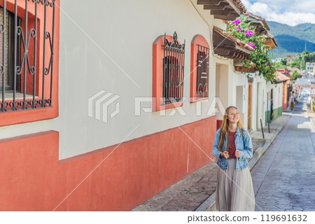 Female tourist walks through the colonial streets San Cristobal de las Casas, Mexico. Cultural exploration, architecture, and travel experience concept 119691632