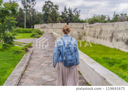 Female tourist exploring the Loreto Fort Museum in Puebla, Mexico. Cultural heritage, history, and travel exploration concept 119691675