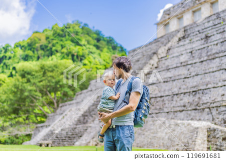 Father with his toddler son exploring the ancient pyramids of Palenque, Mexico, surrounded by dense jungle. Cultural heritage and adventure travel concept Father with his toddler son exploring the ancient pyramids of Palenque, Mexico, surrounded by dense jungle. Cultural heritage and adventure travel concept 119691681