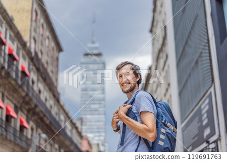 Male tourist exploring Latin American Tower in Mexico City. Iconic skyscraper, historic architecture, and urban exploration concept 119691763