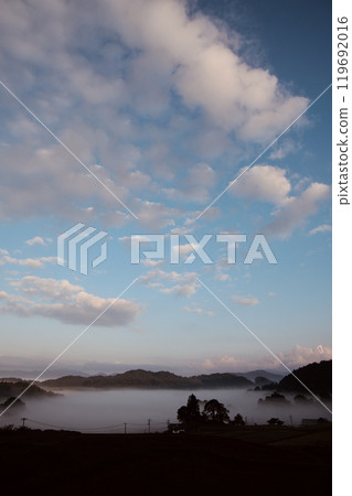 Background material: Rural landscape with morning mist, blue sky and white clouds, copy space 119692016