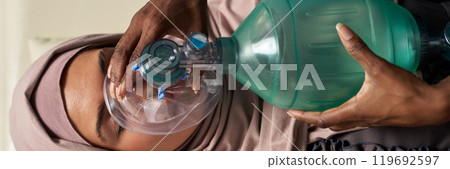 Administering CPR Using Breathing Apparatus 119692597