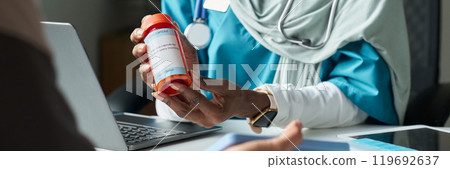 Muslim Medical Professional Discussing Prescription Options 119692637