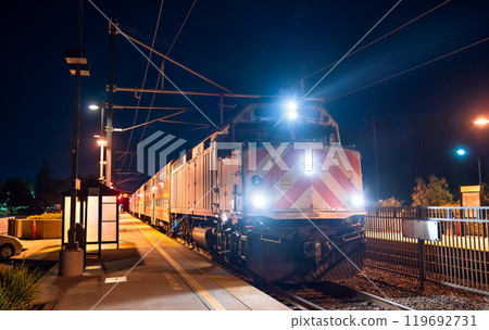 Old diesel locomotive with a commuter train at California Avenue station in Palo Alto, California, United States Old diesel locomotive with a commuter train at California Avenue station in Palo Alto, California, United States 119692731