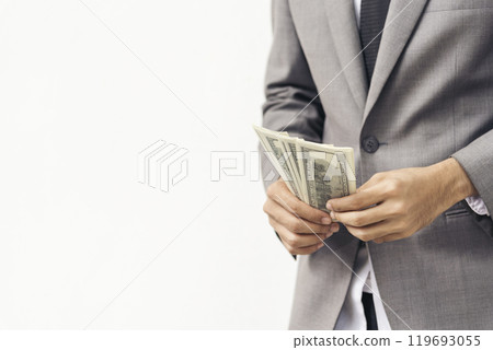 Hand holding loan money dollar bank note give financial payment. Man hands showing spread 100 dollar exchange cash payout. Saving Businessman counting money banknote bribe corruption concept. Hand holding loan money dollar bank note give financial payment. Man hands showing spread 100 dollar exchange cash payout. Saving Businessman counting money banknote bribe corruption concept. 119693055