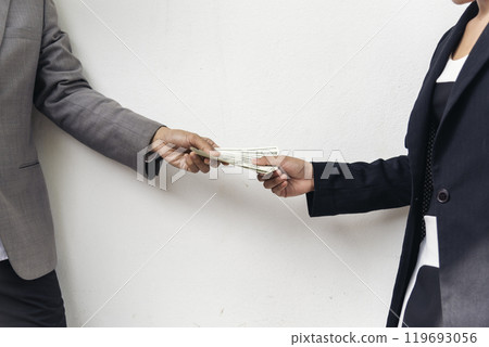 Close up hands giving money bribe payment. Hands holding dollar bill bribery financial economy business people. Business people corrupt illegal settlements try to pay graft. Corruption bribe concept Close up hands giving money bribe payment. Hands holding dollar bill bribery financial economy business people. Business people corrupt illegal settlements try to pay graft. Corruption bribe concept 119693056