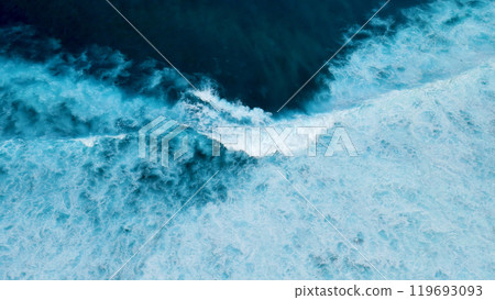 Turquoise ocean sea water white wave pattern splashing deep blue sea. Seascape dark ocean background wave splash on rock. Tropical sea beach in summer seaside outdoor. Water Surface blue wave pattern Turquoise ocean sea water white wave pattern splashing deep blue sea. Seascape dark ocean background wave splash on rock. Tropical sea beach in summer seaside outdoor. Water Surface blue wave pattern 119693093