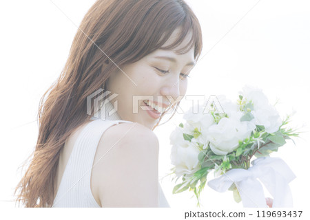 Woman holding a white bouquet Woman holding a white bouquet 119693437
