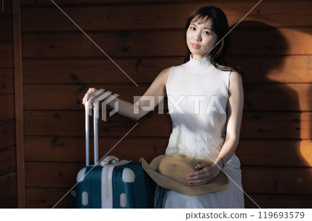 A woman waiting for a bus 119693579