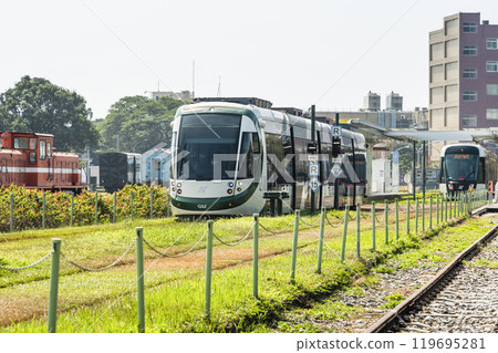 The circular light rail train drives past Hamasen Railway Cultural Park in Kaohsiung, Taiwan. 119695281