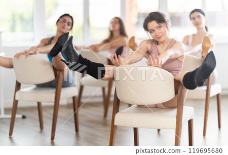 Sitting on chair, girl train to perform lap dance, interacting with imaginary partner Sitting on chair, girl train to perform lap dance, interacting with imaginary partner 119695680