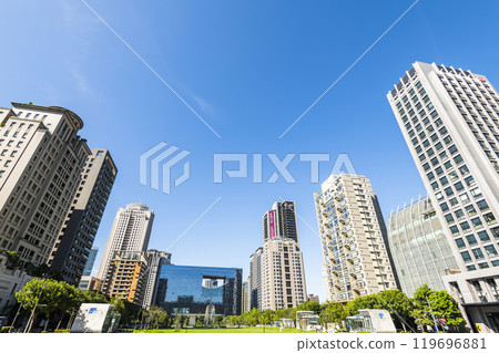 View of the park and surrounding modern buildings in front of Taichung City Council, Taiwan. 119696881