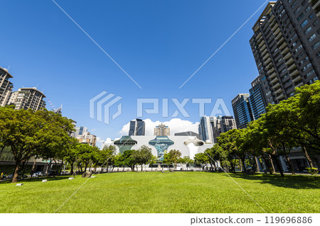 The large area of park space in front of the National Taichung Theater in Taiwan and the landscape of modern buildings on both sides. The large area of park space in front of the National Taichung Theater in Taiwan and the landscape of modern buildings on both sides. 119696886
