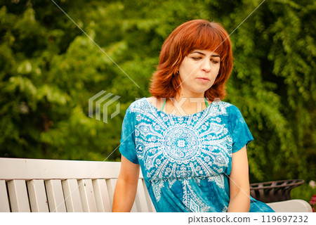 The girl with the red hair in the leaves 119697232