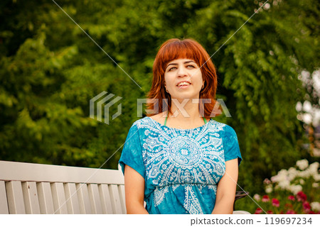 The girl with the red hair in the leaves 119697234