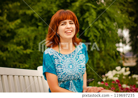The girl with the red hair in the leaves The girl with the red hair in the leaves 119697235