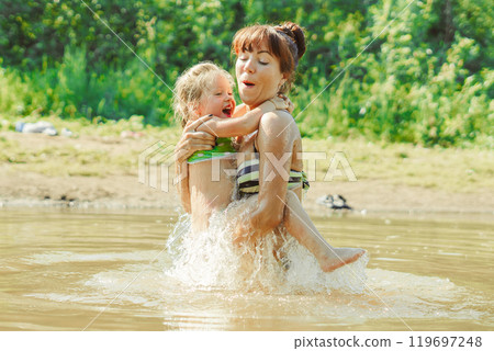 mom and child swim in the river mom and child swim in the river 119697248