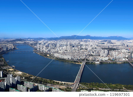 Aerial view cityscape of Seoul. Top view of Seoul, capital of South Korea. High angle view of Seoul with modern residential neighbourhoods, Han River and mountains 119697301