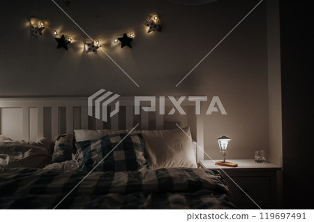 Simple modern bedroom in the attic with wooden furniture and wooden floors. 119697491