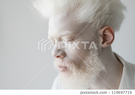 young albino man with white hair and beard, wearing white clothes on a white background, fashionable portrait 119697719