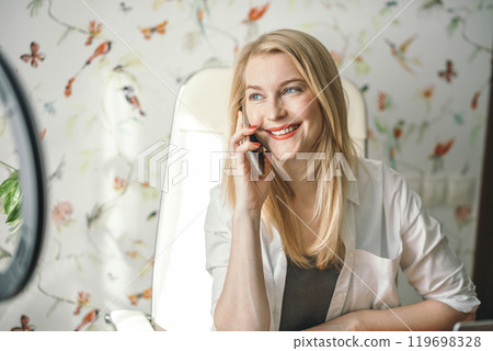 woman consultant confidently discussing strategies and solutions with business client on smartphone 119698328