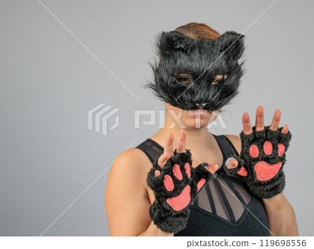 Portrait of a woman in a cat costume on a white background. Quadrober.  119698556