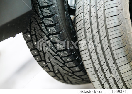 Comparison of old and new studded car tires. Comparison of old and new studded car tires. 119698763