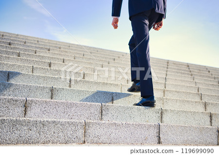 Business image: The feet of a man in a suit 119699090