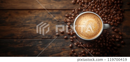 A white cup of hot cappuccino with coffee beans stands on a wooden background. Rustic style, space for text A white cup of hot cappuccino with coffee beans stands on a wooden background. Rustic style, space for text 119700419