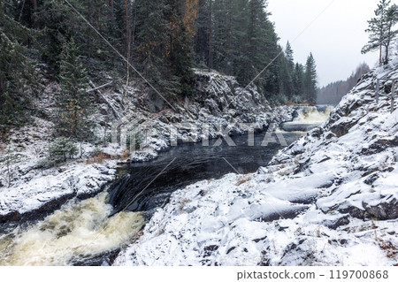 Snowy cascade waterfall. Landscape photography of Kivach Falls 119700868