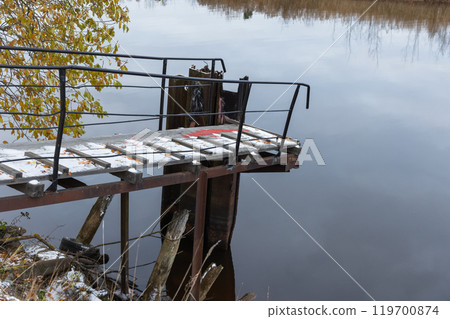 Small pier covered with snow at Ladoga lake coast Small pier covered with snow at Ladoga lake coast 119700874