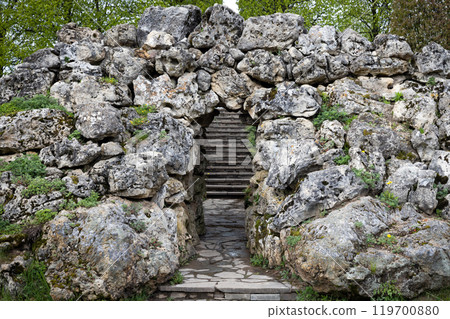 Old stone grotto with a stairway on the background 119700880