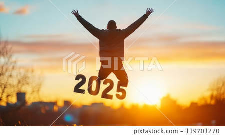 A man jumps joyously with the numbers '2025' at a golden sunrise, symbolizing optimism and excitement for the New Year. 119701270