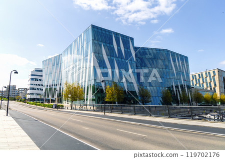 Modern glass office building in an expensive area of Copenhagen, Denmark. 119702176
