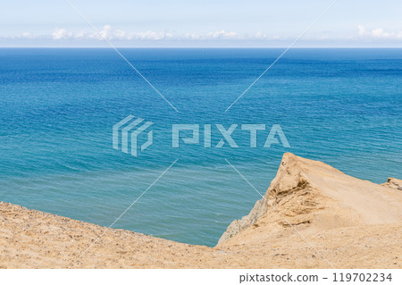 Panorama of sand dunes and blue sea. 119702234