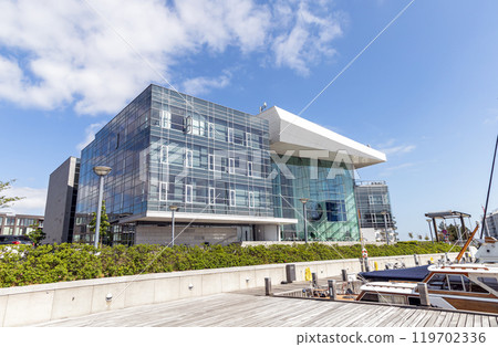 Modern glass office building in an expensive area of Copenhagen, Denmark. 119702336