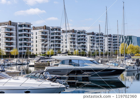 Yacht parking. A marina lot. Yacht and sailboat is moored at the quay. Yacht parking. A marina lot. Yacht and sailboat is moored at the quay. 119702360