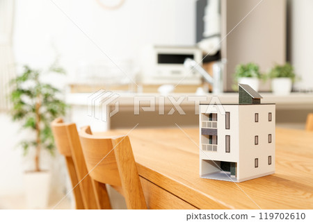 A model house placed in the living/dining/kitchen area 119702610