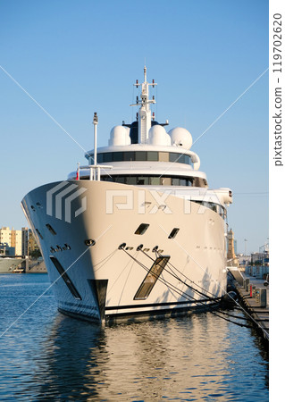 The ship is moored at the boat station, close-up The ship is moored at the boat station, close-up 119702620