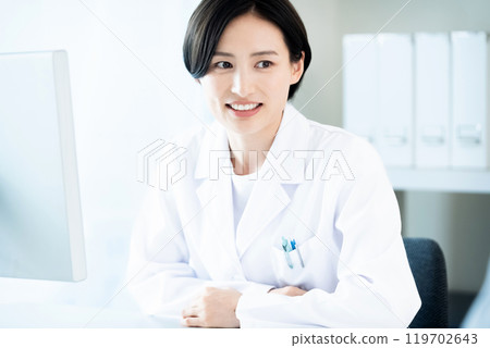 A lady in white 119702643