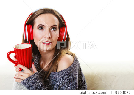 Woman with headphones listening music 119703072