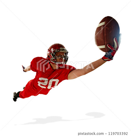 Dynamic image of man, American football player in red uniform, catching ball in motion isolated on white background. Dynamic image of man, American football player in red uniform, catching ball in motion isolated on white background. 119703392