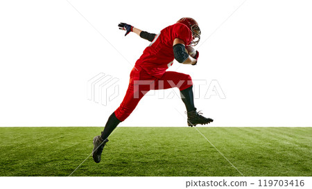 Dynamic image of American football player in red uniform sprinting across the field while holding the ball, training, competing for victory. 119703416
