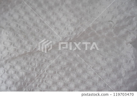 Recycled perforated white paper close up texture Recycled perforated white paper close up texture 119703470