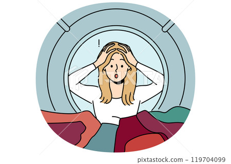 Woman housewife peeks into washing machine and grabs head after seeing ruined clothes Woman housewife peeks into washing machine and grabs head after seeing ruined clothes 119704099