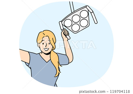 Woman dentist with surgical lamp smiling, standing in operating room and cheering patient Woman dentist with surgical lamp smiling, standing in operating room and cheering patient 119704118